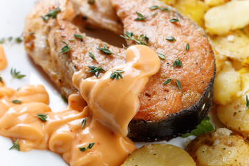 Roasted  salmon with potatoes.