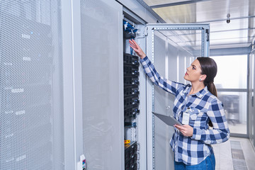 female technician working on server maintenance