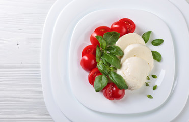 Mozzarella with tomato and  basil.