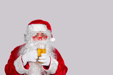 Fototapeta na wymiar Santa claus show glass of beer,after party las night,Happy christmas day,Happy time with family