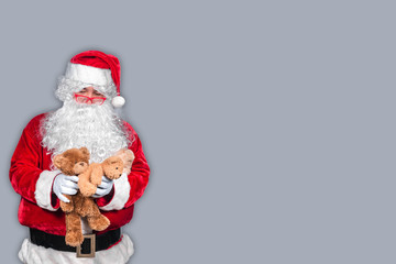 Santa claus have a teddy for children,merry christmas,Gifts for Children,Portrait of santa claus on white background,December is the month of Christmas.