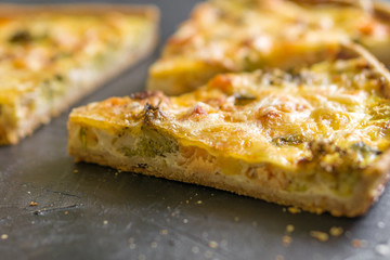 Traditional French pie Quiche with salmon and broccoli