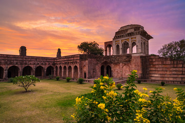 Mandu India, afghan ruins of islam kingdom, mosque monument and muslim tomb. Colorful sky at...