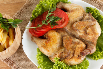 Chicken fried with potato and vegetables