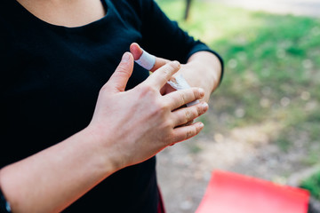 midsection woman hands wrapped with bands - practicing, exercise, sport concept