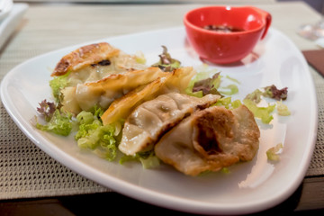 Japanese gyoza dumplings minced with pork and chicken meat and served at the restaurant of Belgrade, Serbia