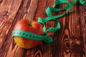 Fresh, ripe apples on an old wooden table. Fruit to comply with the diet