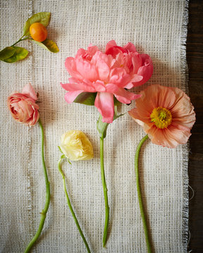 Overhead view of colorful flowers on a hemp cloth