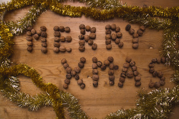 Beautiful Christmas scene with great headline “Merry Xmas” surrounded by golden and silver decorative chains.