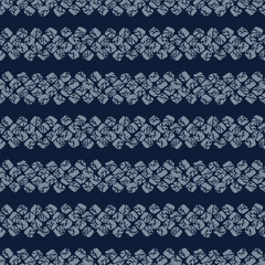 Japanese Shibori ornament. Asian seamless pattern. Horizontal motif. Dark indigo background. Classic japanese dyeing technique. Plain backdrop for decoration, wallpaper or handiwork.