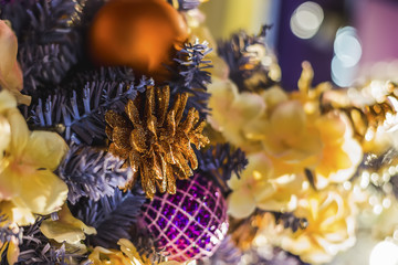 New Year and Christmas decorations - blue spruce, balls, flowers, garlands, bumps.