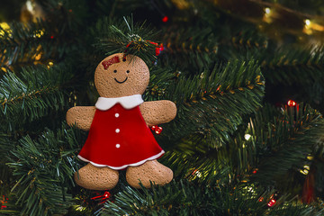 New Year and Christmas festive decorations: Christmas tree, gingerbread, lights.