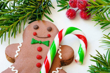 Closeup of an old fashioned candy cane and a gingerbread man