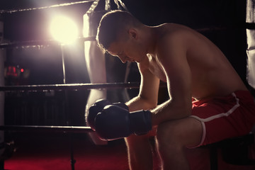 Professional boxer having break during training