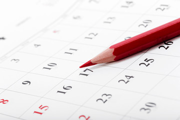Check out the dates in a business calendar concept
