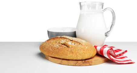 Bread and milk on the table