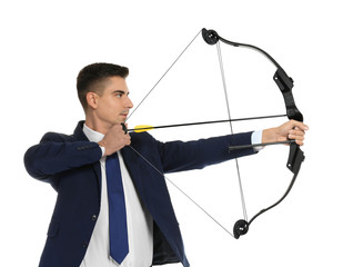 Young businessman practicing archery on white background