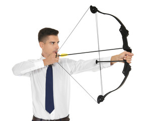 Young businessman practicing archery on white background