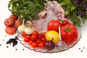 Raw lamb meat with vegetables