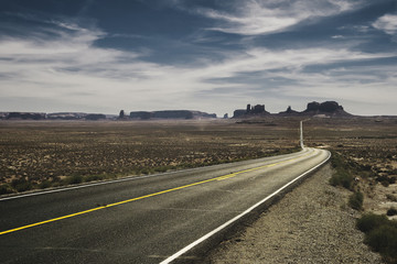 Classic view of the highway 163 from the Forrest Gump Point in the Monument Valley Navajo Tribal Park in summer, Utah.