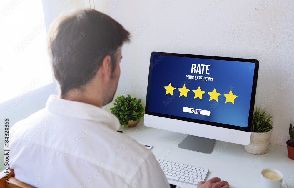 Poster man rating on computer
