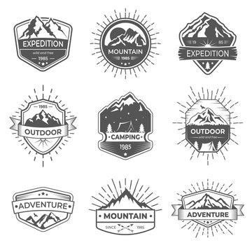 Set of nine vector mountain and outdoor adventures logo. Logotype templates and badges with mountains, trees, tent