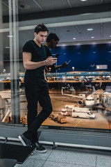 Man is waiting airplane departure in airport