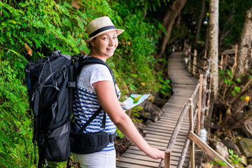 Naklejka na ściany i meble tourist hiking along the trail in Asia