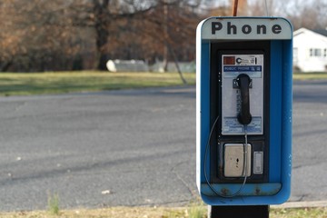 Pay phone on a rural road - obrazy, fototapety, plakaty