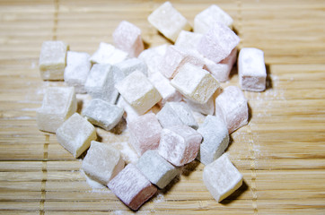 Turkish Delight in powdered sugar. Close-up, selective focus.