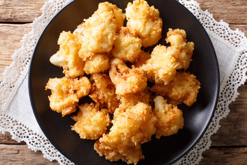 Vegetarian meal: fried cauliflower in breadcrumbs closeup. horizontal top view