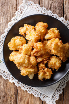 fried cauliflower in breading close-up. Vertical top view