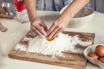 woman in the kitchen while mixing the dough