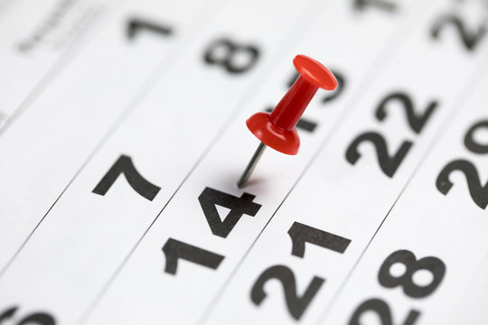 Calendar With Red Thumbtack