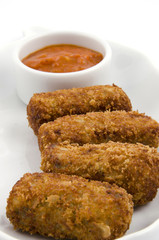 Vegetable croquettes in white plate on white background