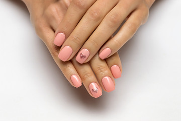 pink manicure with golden hearts on nameless fingers on short nails

