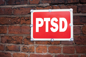 Hand writing text caption inspiration showing PTSD Post-Traumatic Stress Disorder  concept meaning Health Treatment written on old announcement road sign with background and copy space