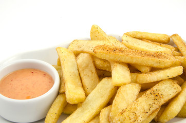 potato fries and sauce on the plate on the white background