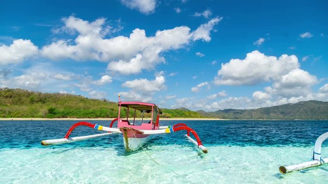 Timelapse Traditional boat in turquoise water on the island of Gili Nanggu, Lombok, Indonesia