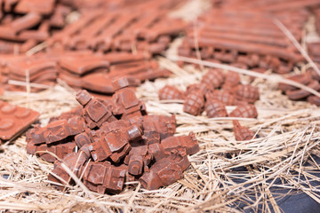 Close up of tiny robots made of chocolate outdoor on food festival