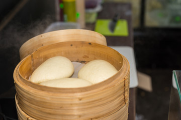 Chinese steamed bun in bamboo steamed at outdoor food festival