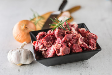 Beef. Raw sliced beef meat garlic onion salt pepper and rosemary