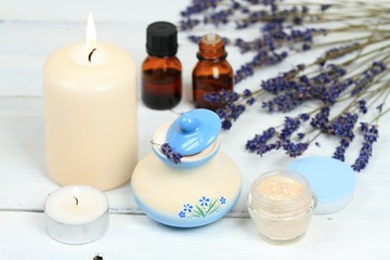 Obraz na płótnie Canvas Lavender spa composition, beauty treatment, candle, cream, essential oil