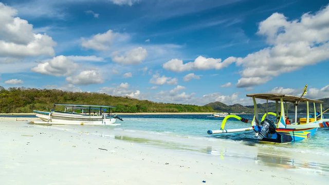 Timelapse Boat on the beach with turquoise water on the Gili Nanggu, Lombok, Indonesia