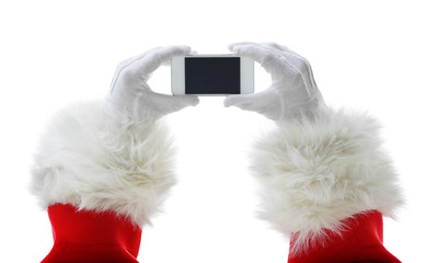 Christmas concept shot with Santa holding a white smart phone Isolated on white