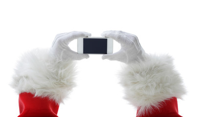 Christmas concept shot with Santa holding a white smart phone Isolated on white