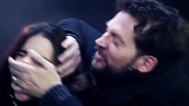 Beautiful woman at night assaulted by man on street