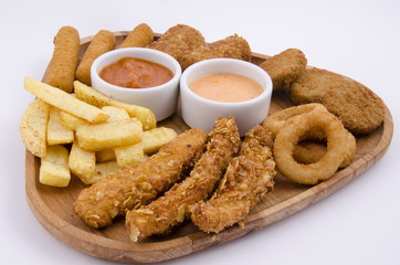 mixed snack fries on wood board