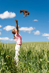 Dog falling from the sky in to girl's arms