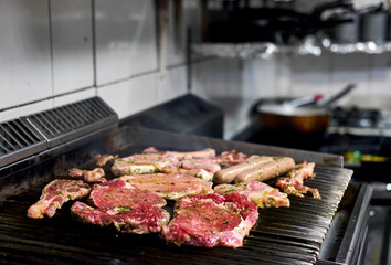 Assorted of a raw meat on the barbecue grill